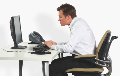poor sitting posture leading to upper back pain